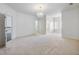 Spacious main bedroom with carpet and access to other rooms at 335 Enclave Cir, Atlanta, GA 30342