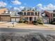 Brick home with three-car garage and manicured landscaping at 335 Enclave Cir, Atlanta, GA 30342