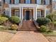 Elegant entryway with brick steps, iron railing and landscaping at 335 Enclave Cir, Atlanta, GA 30342