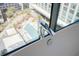 Modern bathroom featuring a stylish faucet, soaking tub and a view of the building's outdoor swimming pool at 40 12Th Ne St # 1701, Atlanta, GA 30309