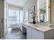 Luxurious bathroom with a soaking tub, dual vanity, and city views at 40 12Th Ne St # 1701, Atlanta, GA 30309