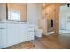 Modern bathroom featuring a glass shower, sleek vanity, and tiled flooring at 40 12Th Ne St # 1701, Atlanta, GA 30309