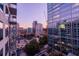Captivating city view with a vibrant sunset, showcasing modern architecture and lush greenery at 40 12Th Ne St # 1701, Atlanta, GA 30309
