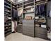 Spacious walk-in closet with custom shelving, drawers, and ample storage for clothes and accessories at 40 12Th Ne St # 1701, Atlanta, GA 30309
