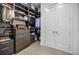 Spacious walk-in closet with custom shelves, drawers, and double doors at 40 12Th Ne St # 1701, Atlanta, GA 30309