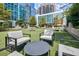 Outdoor courtyard with comfortable seating and lush greenery at 40 12Th Ne St # 1701, Atlanta, GA 30309