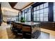 Elegant island with a marble countertop and comfortable seating with modern lighting at 40 12Th Ne St # 1701, Atlanta, GA 30309