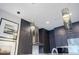 Modern kitchen featuring dark wood cabinets, stainless steel appliances, and stylish pendant lighting at 40 12Th Ne St # 1701, Atlanta, GA 30309