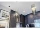 Modern kitchen with dark cabinets and unique pendant lighting at 40 12Th Ne St # 1701, Atlanta, GA 30309