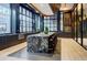 Stylish kitchen island with leather stools, a marble countertop, and sleek dark cabinetry at 40 12Th Ne St # 1701, Atlanta, GA 30309
