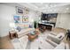 Inviting living room with stylish furnishings that opens up to a modern kitchen with an island at 40 12Th Ne St # 1701, Atlanta, GA 30309