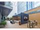 Outdoor deck with seating, fire pit, and large screen TV at 40 12Th Ne St # 1701, Atlanta, GA 30309