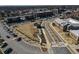 Aerial view of a town center with parking and green spaces at 106 Laurel Brook Ln, Canton, GA 30115