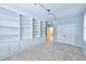 Spacious bedroom with built-in shelving and an adjacent door at 1735 Peachtree Ne St # 129, Atlanta, GA 30309