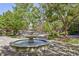 Courtyard with a beautiful fountain and lush landscaping at 1735 Peachtree Ne St # 129, Atlanta, GA 30309