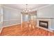 Open concept dining room with hardwood floors and fireplace at 1735 Peachtree Ne St # 129, Atlanta, GA 30309