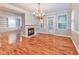 Spacious dining room featuring hardwood floors, fireplace, and built-in shelves at 1735 Peachtree Ne St # 129, Atlanta, GA 30309