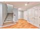 Bright entryway with hardwood floors and staircase leading upstairs at 1735 Peachtree Ne St # 129, Atlanta, GA 30309