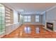 Living room with hardwood floors, built-in shelving, and fireplace at 1735 Peachtree Ne St # 129, Atlanta, GA 30309