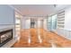 Hardwood floors, fireplace, and built-in shelving in this living room at 1735 Peachtree Ne St # 129, Atlanta, GA 30309