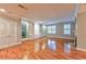 Large living room featuring hardwood floors and built-in shelving at 1735 Peachtree Ne St # 129, Atlanta, GA 30309