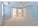 Spacious main bedroom with carpet and access to bathroom and closets at 1735 Peachtree Ne St # 129, Atlanta, GA 30309