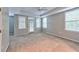 Spacious main bedroom with neutral walls, carpet, and private patio access at 1735 Peachtree Ne St # 129, Atlanta, GA 30309