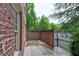 Brick patio with adjacent pool and privacy fence at 1735 Peachtree Ne St # 129, Atlanta, GA 30309