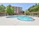 Community pool with plenty of lounge chairs for relaxing at 1735 Peachtree Ne St # 129, Atlanta, GA 30309