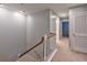 Upper hallway with carpeted floors and access to bedrooms and bathroom at 1735 Peachtree Ne St # 129, Atlanta, GA 30309