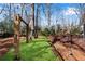 Spacious backyard with wooden playset and deck at 4187 Westchester Ne Trce, Roswell, GA 30075