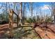 Spacious backyard with wooden playset and deck at 4187 Westchester Ne Trce, Roswell, GA 30075