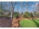 Landscaped backyard with mature trees at 4187 Westchester Ne Trce, Roswell, GA 30075