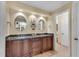 Double vanity bathroom with granite countertops and large mirrors at 4187 Westchester Ne Trce, Roswell, GA 30075