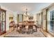 Elegant dining room with hardwood floors, chandelier, and large windows at 4187 Westchester Ne Trce, Roswell, GA 30075