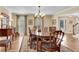 Formal dining room with hardwood floors, chandelier, and views to entry at 4187 Westchester Ne Trce, Roswell, GA 30075