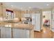 Modern kitchen with granite island and hardwood floors at 4187 Westchester Ne Trce, Roswell, GA 30075