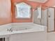 Bathroom with a jetted tub and a separate shower at 4251 Sheffield Nw Ct, Kennesaw, GA 30144