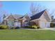 Brick house with a two-car garage and lush green lawn at 4251 Sheffield Nw Ct, Kennesaw, GA 30144