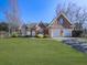 Brick house with two-car garage and landscaping at 4251 Sheffield Nw Ct, Kennesaw, GA 30144