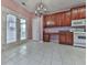 Bright kitchen with wood cabinets, tile floor, and breakfast area at 4251 Sheffield Nw Ct, Kennesaw, GA 30144