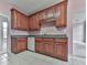 Kitchen with dark wood cabinets and tiled floor at 4251 Sheffield Nw Ct, Kennesaw, GA 30144