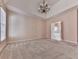 Main bedroom with chandelier and access to bath at 4251 Sheffield Nw Ct, Kennesaw, GA 30144