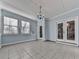 Sunroom with light blue walls and tile floor at 4251 Sheffield Nw Ct, Kennesaw, GA 30144