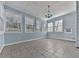 Sunroom with multiple windows and tile floor at 4251 Sheffield Nw Ct, Kennesaw, GA 30144