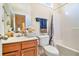 Small bathroom with wood vanity and shower/tub at 7165 Fringe Flower Dr # 5, Austell, GA 30168