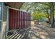 Backyard access with wooden gate and community view at 1004 Masons Creek Cir # 1004, Atlanta, GA 30350