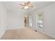 Bright bedroom with ceiling fan and neutral carpeting at 1004 Masons Creek Cir # 1004, Atlanta, GA 30350