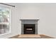 Gray fireplace with wood mantel in living room at 1004 Masons Creek Cir # 1004, Atlanta, GA 30350