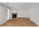 Bright living room with fireplace and wood-look floors at 1004 Masons Creek Cir # 1004, Atlanta, GA 30350